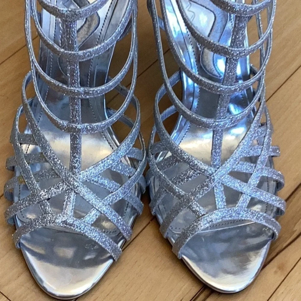 Nina silver glittery, strappy high heels, zipper to back. Women’s size 7